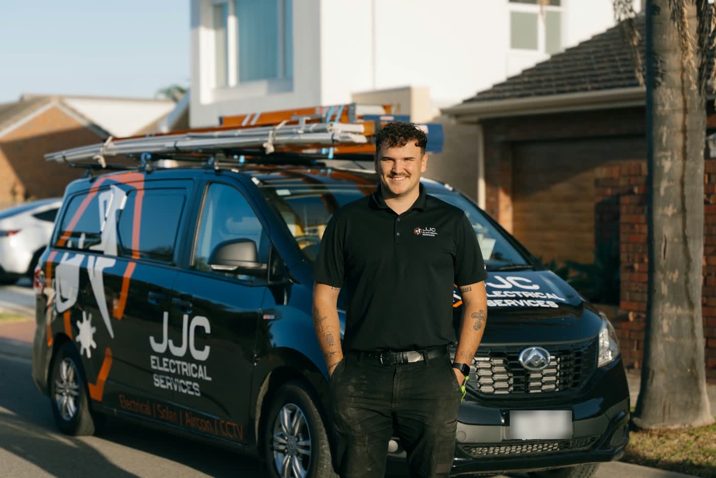 James from JJC Electrical beside the JJC work van