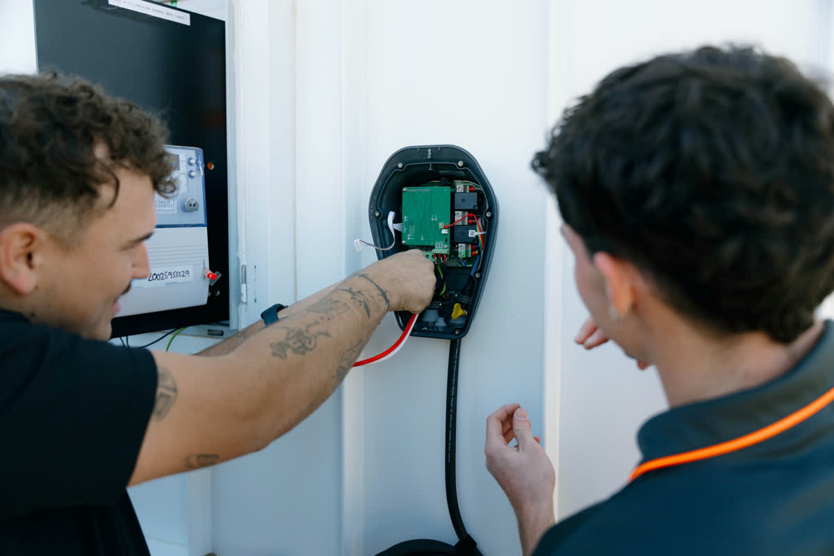 Two JJC electricians fitting an Ocular EV charger