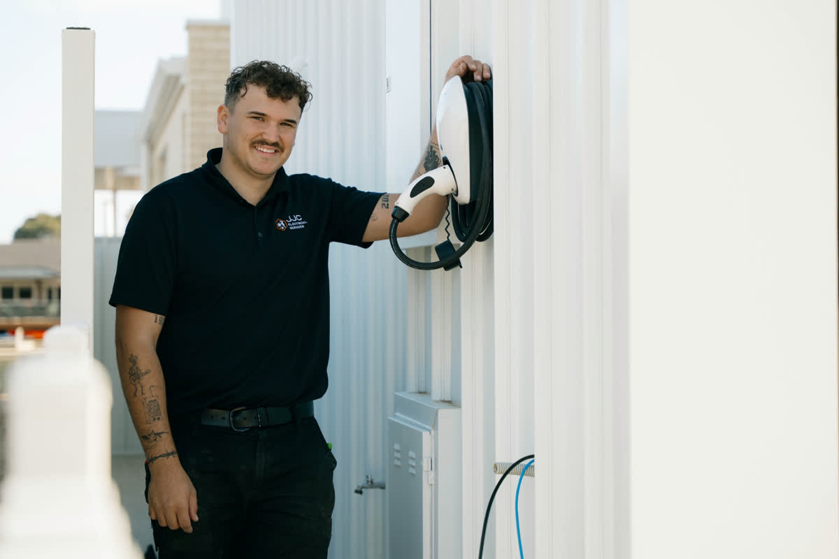 James beside a newly installed EV charger