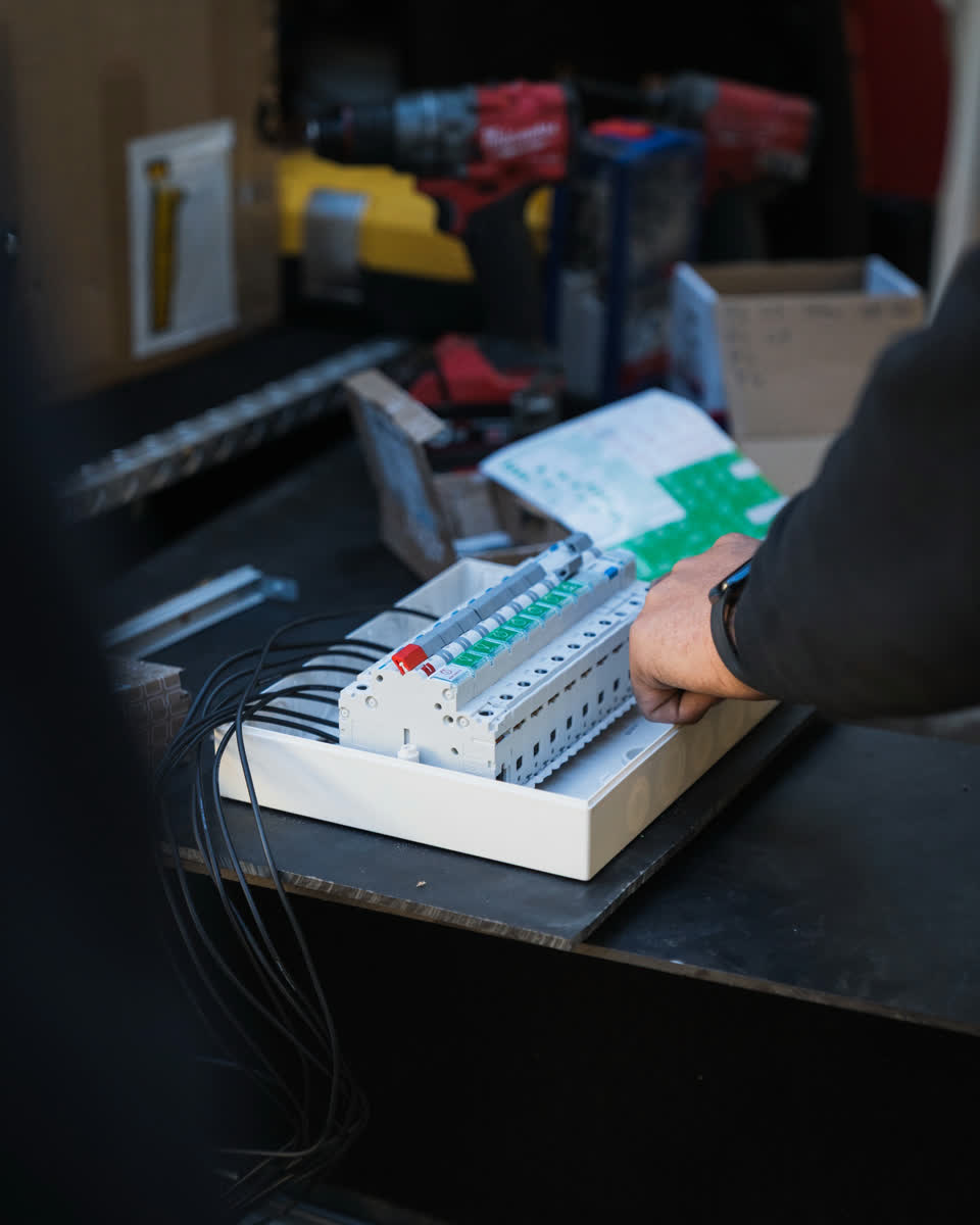 A new switchboard being assembled on the workbench